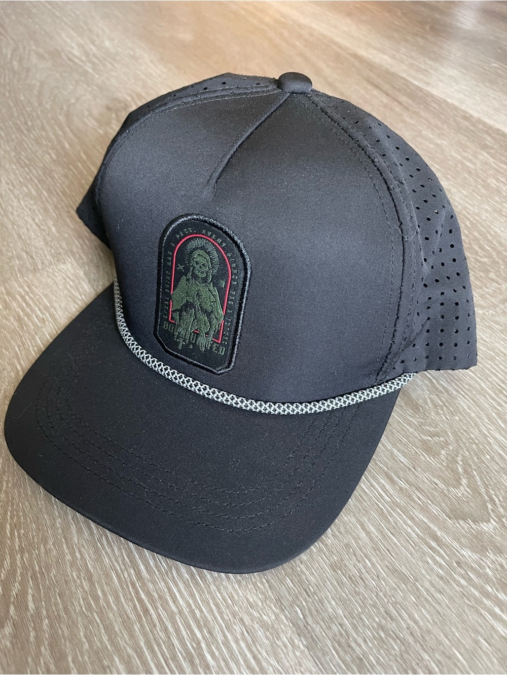 Born United Black Trucker Cap with Embroidered Saint Patch and Rope